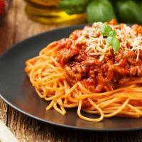 The Beef Bolognese Pasta · Ground beef cooked in spicy marinara sauce and sitting on a bed of pasta.