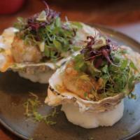 Crunchy Oyster · soy butter garlic sauce, scallions, cilantro, lime zest