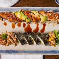 Spider Roll · Soft shell crab tempura, lettuce, avocado, seaweed outside with eel sauce.