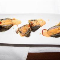 Volcano Roll · Crab meat, avocado, and cream cheese deep fried with spicy tuna, spicy mayo, and eel sauce o...