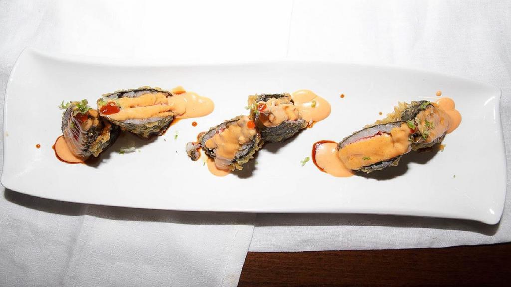 Volcano Roll · Mixed of spicy white tuna, spicy red snapper, spicy tuna, spicy salmon crunch, and caviar on top.