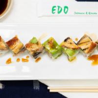 Dragon · Crabmeat, avocado, cucumber, crunch rolled and topped with eel, avocado, eel sauce.