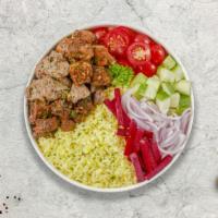 Chicken & Lamb Gyro On Rice · Thinly sliced pieces of chicken and lamb gyro meat marinated in a mediterranean blend of her...