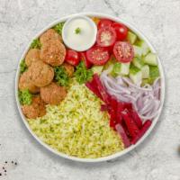 Falafel Combo On Rice · Crispy falafel balls with your choice of gyro meat served on a sizzling bed of rice, lettuce...