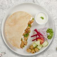 Chicken Gyro On Pita · Thinly sliced pieces of chicken marinated in a mediterranean blend of herbs and spices with ...