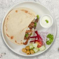 Chicken & Lamb Gyro On Pita · Thinly sliced pieces of chicken and lamb gyro meat marinated in a mediterranean blend of her...