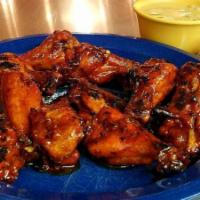Smoked Wings · Chargrilled with your choice of buffalo style, honey garlic, or any of our house-made sauces.