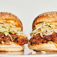 Fried Chicken Dagwich · Spicy remoulade, cured tomatoes, red onion, baby Swiss.