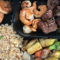 Hibachi Shrimp & Steak Combo · Most popular. New York sirloin with jumbo shrimp.  and served with soup or salad, vegetables...