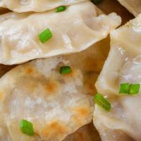 Vegetable Dumplings · Steamed dumplings filled with mixed vegetables and served with homemade soy vinaigrette.