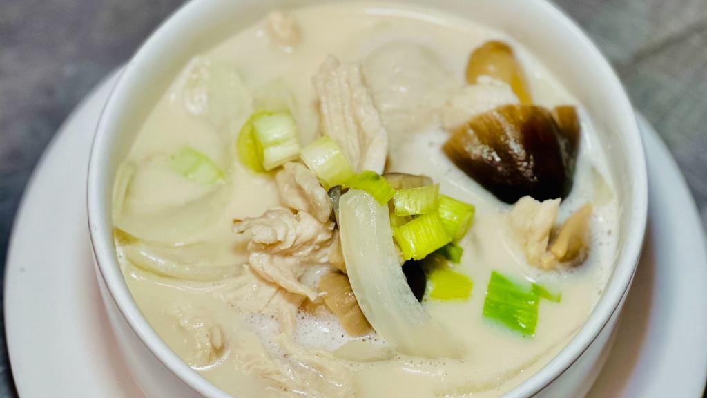 Tom Kha · Lemongrass, mushrooms, and galangal topped with scallions in a light coconut broth.