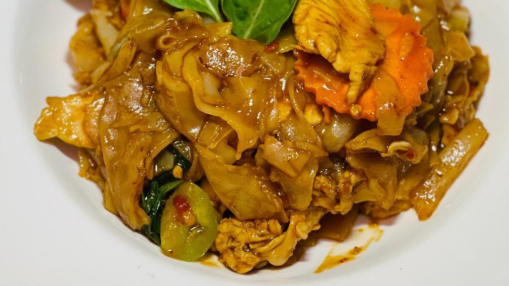 Pad Kee Mow (Drunken Noodles) · Spicy. Stir-fried flat rice noodles, chili, bell peppers, carrots, basil, onions, and egg in a spicy sauce.