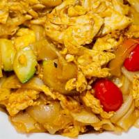 Sriracha Noodles · Stir-fried flat rice noodles, cucumber, onions, tomatoes, bell peppers and egg in a sweet an...