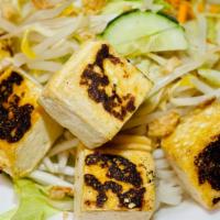 Bún Tofu  · Grilled tofu with THIN NOODLES, basil, bean sprout, carrots and cucumber served with sweet c...
