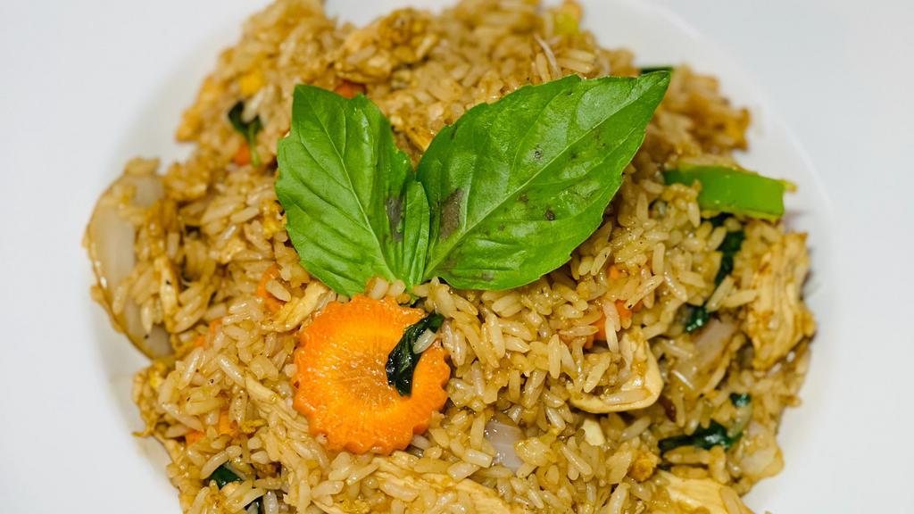 Basil Fried Rice · Spicy fried rice with chili peppers, basil, carrots, bell peppers, onions and egg