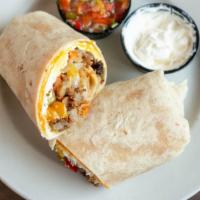 Breakfast Burrito · Two scrambled eggs, onions, peppers, sausage, tots, cheddar jack, with sour cream & salsa
