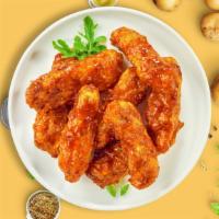 Bbq Business Tenders · Chicken tenders breaded and fried until golden brown before being tossed in barbecue sauce.