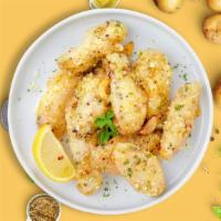 Parmesan Clovin' Wings · Fresh chicken wings breaded, fried until golden brown, and tossed in garlic and parmesan. Se...