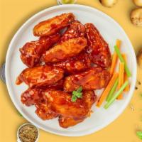 Buffalovin' Wings · Fresh chicken wings breaded, fried until golden brown, and tossed in buffalo sauce. Served w...