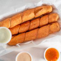 Tequenos · Cheese stuffed fried bread.  { 3 PER ORDER}