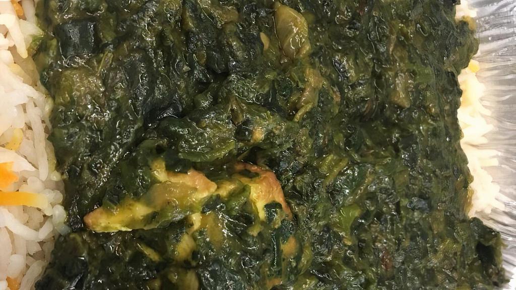 Palak Paneer  · Homestyle cheese simmered in freshly pureed spinach lightly spiced.