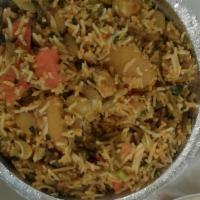 Vegetable Biryani (Vegan) · Saffron flavored basmati rice cooked with fresh vegetables and Indian spices. Served with ra...