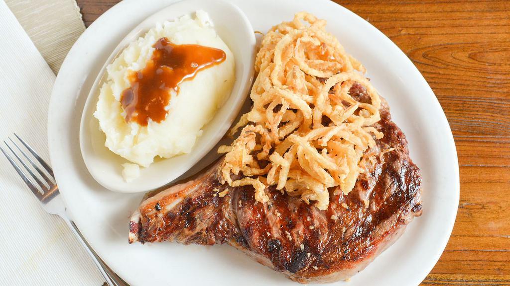 Cowboy Steak 24Oz · Bone-In Ribeye available Marinated or plain. Served with our House salad and side dish.