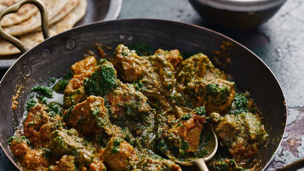 Lamb Saag · Boneless Lamb cooked in creamy spinach sauce. Served with a side of basmati rice.