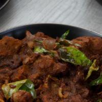 Lamb Sukka · South Indian spicy lamb fry. Served with a side of basmati rice.
