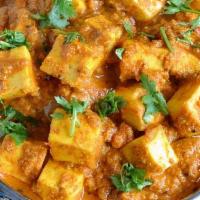 Tofu Chettinad · Tofu curry cooked with star anise, curry leaves and coconut. Served with a side of basmati r...