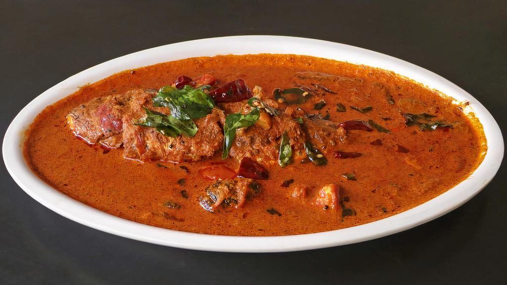 Malabar Fish Curry · Coconut Fish curry tempered with mustard seeds and curry leaves. Served with a side of basmati rice.