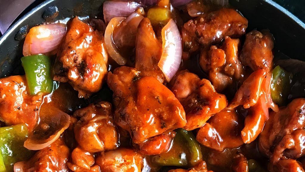 Chili Garlic Chicken · Boneless chicken stir fried with onions and bell pepper in indo-chinese sauce.