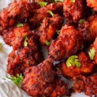 Chicken Pakora · Chicken cubes marinated and crumbed with spiced gram flour and deep fried, served with mint ...