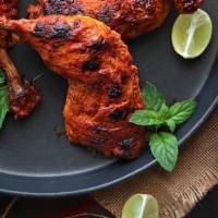 Tandoori Chicken · Chicken leg quarter marinated in spiced yogurt cooked in traditional clay oven. Served with ...