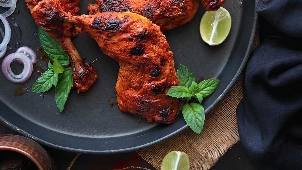 Tandoori Chicken · Chicken leg quarter marinated in spiced yogurt cooked in traditional clay oven. Served with mint sauce.