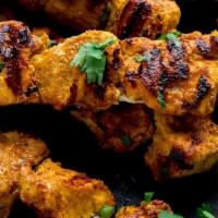 Chicken Tikka · Boneless chicken marinated in spiced yogurt cooked in traditional clay oven, served with mint.