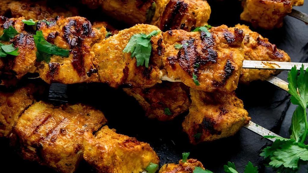Chicken Tikka · Boneless chicken marinated in spiced yogurt cooked in traditional clay oven, served with mint.