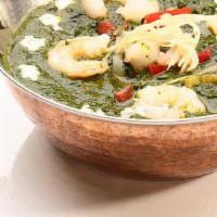 Shrimp Saag · Shrimp cooked in creamy spinach sauce. Served with a side of basmati rice.