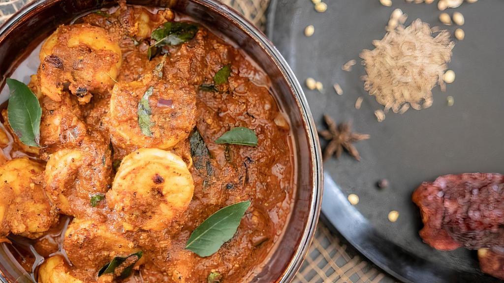 Shrimp Chettinad · Spicy shrimp curry made of star anise, curry leaves and coconut. Served with a side of basmati rice.