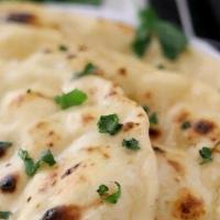 Butter Naan · Special leavened tandoor baked flat bread topped with butter.