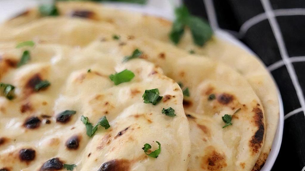 Butter Naan · Special leavened tandoor baked flat bread topped with butter.