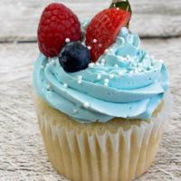 Mixed Berry Cupcake · Vanilla cupcake filled with mixed berry compote and topped with swiss merengue buttercream a...
