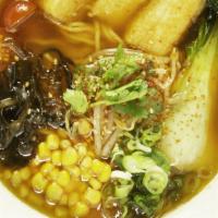 Spicy Miso Butter Ramen · Vegetarian. Fried tofu, kikurage mushrooms, bok choy, corn, tomato, scallion, cilantro, and ...