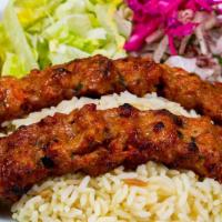 Chicken Adana · Chopped boneless chicken flavored with red bell peppers spices and grilled on skewers.