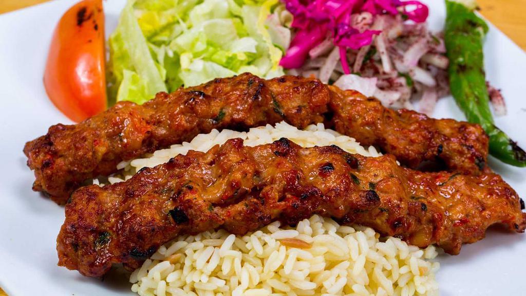 Chicken Adana · Ground boneless chicken flavored with red bell peppers, spices and grilled on skewers.