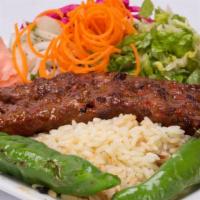 Lamb Adana Kebab · Ground lamb flavored with red bell peppers, slightly seasoned with paprika.