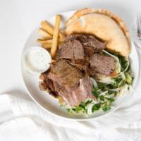Gyro Doner · Combination of freshly ground
beef and lamb sliced thi