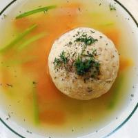 Matzoh Ball Soup · fluffy matzoh ball, carrot, chinese celery, fresh dill in our homemade chicken broth