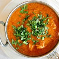 Chicken Korma · Bended herb and spices mild sauce prepared with cashews, raisins and dressed with cream. Ful...