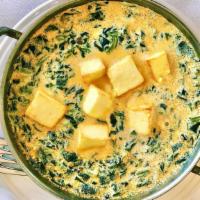 Saag Panir · Homemade cottage cheese deliciously cooked with spinach and garlic tarka. Full size served w...